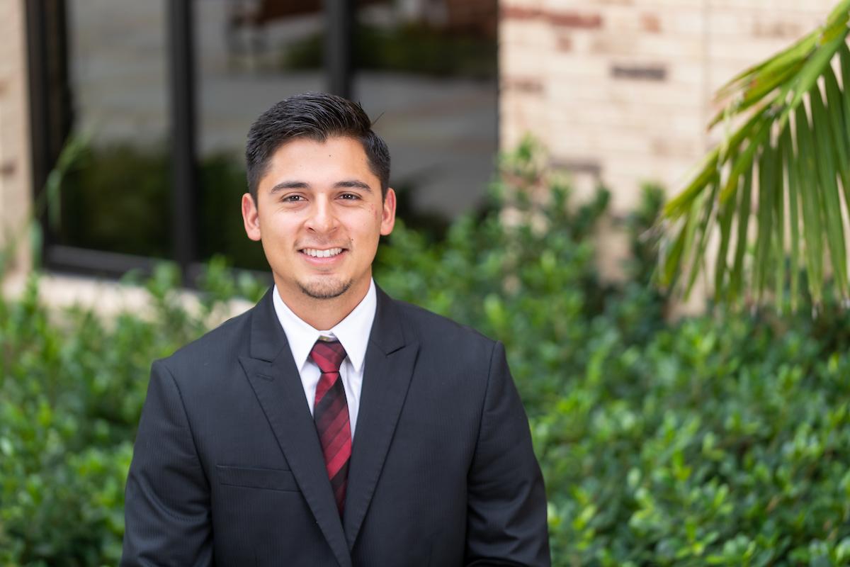 Business student smiling at camera 